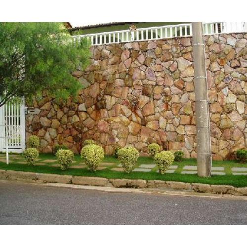 Um muro de pedra com um muro de pedra com textura de pedra.